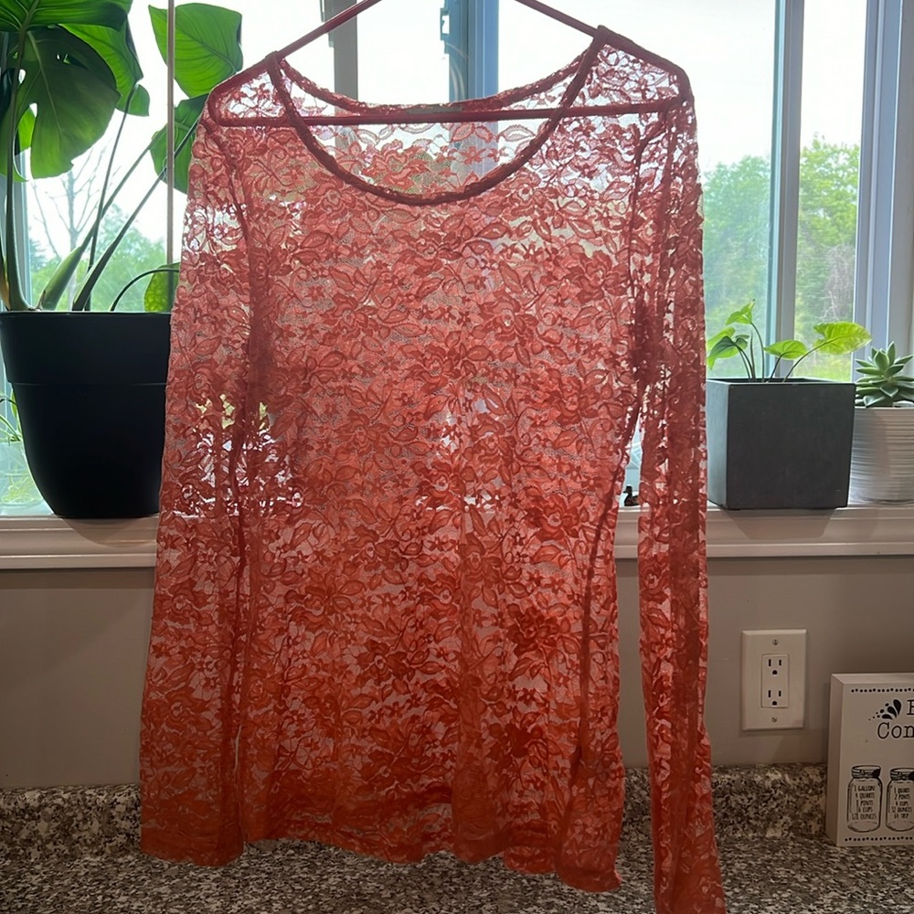 Orange lace sweater over shirt